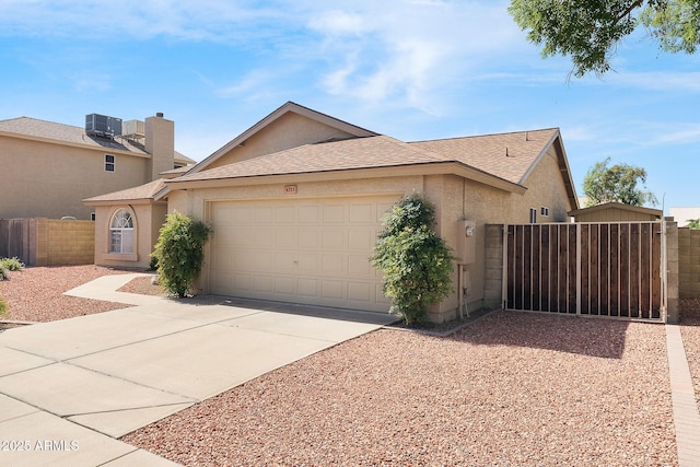 view of front of home with a garage, stucco siding, concrete driveway, fence, and central air condition unit