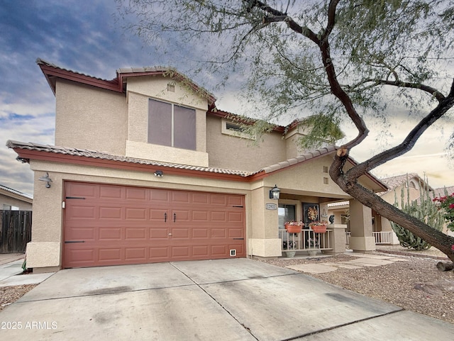 mediterranean / spanish-style home featuring a garage