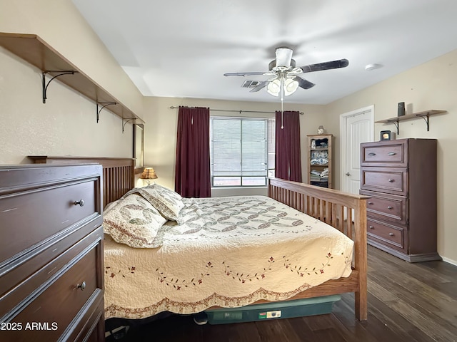 bedroom featuring ceiling fan and dark wood-type flooring