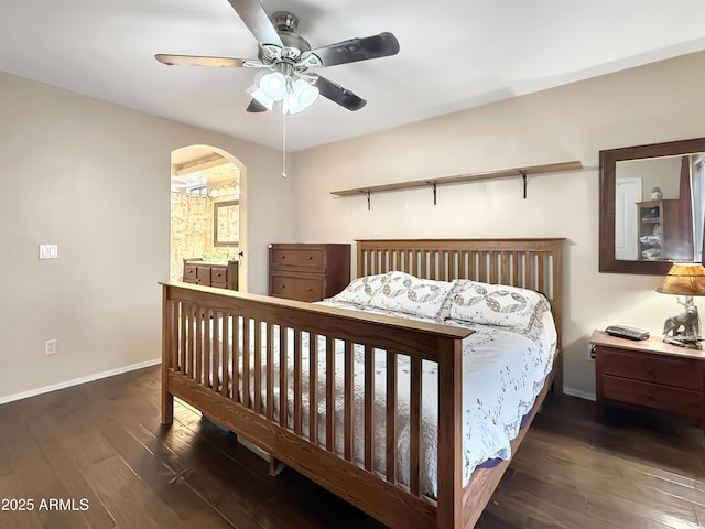 bedroom with connected bathroom, ceiling fan, and dark hardwood / wood-style floors