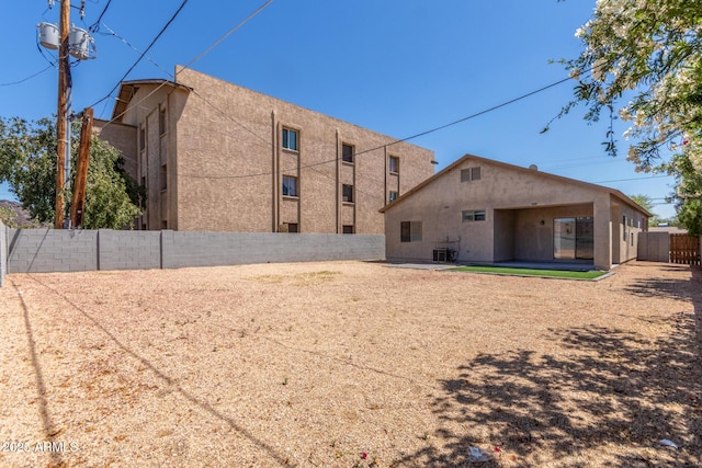 520 E Townley Ave, Phoenix, AZ 85020 - back of property with a patio, a fenced backyard, and stucco siding