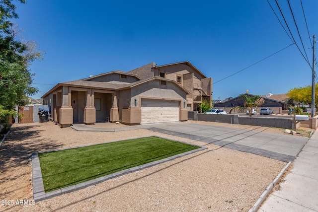 520 E Townley Ave, Phoenix, AZ 85020 - view of front of property featuring a gate, fence, stucco siding, an attached garage, and driveway
