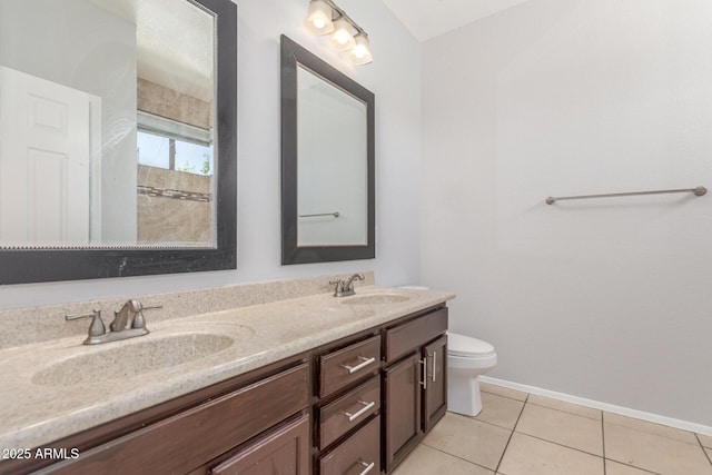 520 E Townley Ave, Phoenix, AZ 85020 - bathroom featuring tile patterned floors, a sink, double vanity, and toilet