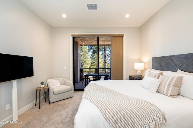 carpeted bedroom featuring access to exterior