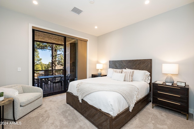 carpeted bedroom with access to outside