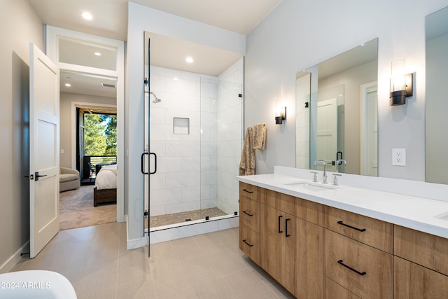 bathroom with vanity and an enclosed shower