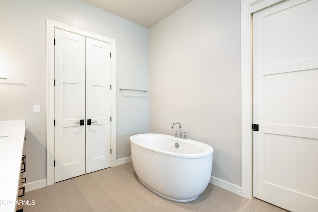 bathroom featuring vanity and a tub