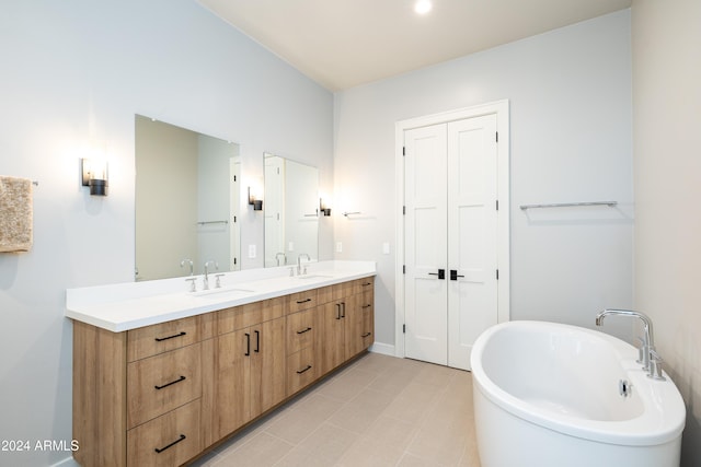 bathroom featuring a tub and vanity