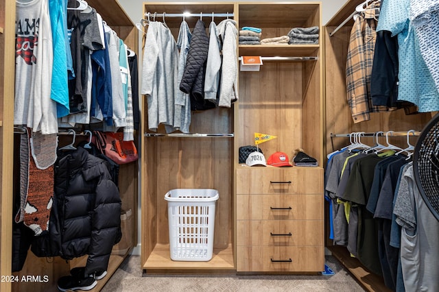 walk in closet featuring carpet