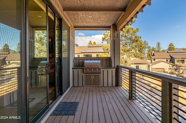 wooden deck featuring grilling area