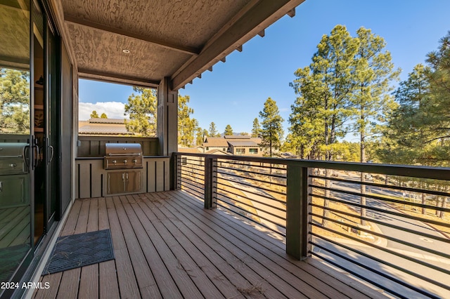 wooden deck featuring grilling area