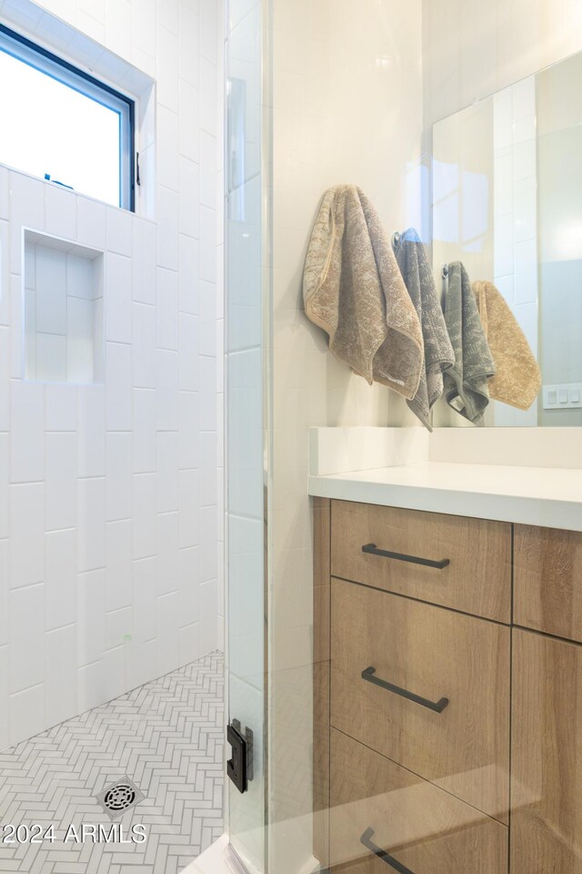 bathroom featuring a shower with door