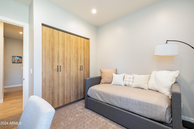 bedroom featuring light hardwood / wood-style floors and a closet