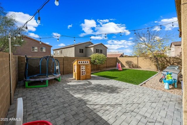 view of patio / terrace with a playground and a trampoline