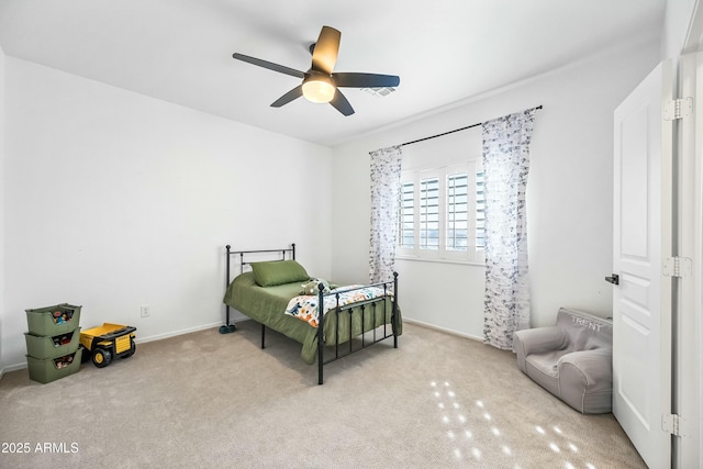 bedroom featuring ceiling fan and light carpet