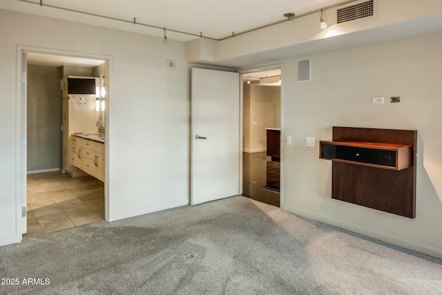 empty room featuring light colored carpet