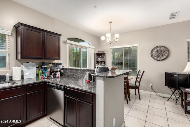 kitchen with pendant lighting, dishwasher, dark stone countertops, light tile patterned flooring, and kitchen peninsula