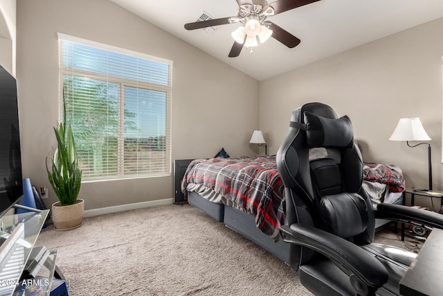 bedroom with lofted ceiling, ceiling fan, and carpet