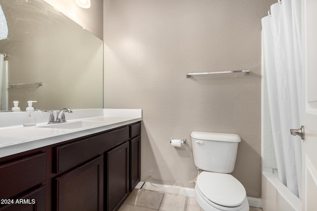 full bathroom with tile patterned flooring, vanity, toilet, and shower / bath combo with shower curtain