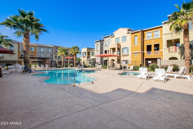 view of swimming pool featuring a patio area