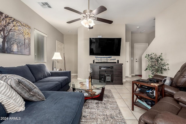 tiled living room with ceiling fan