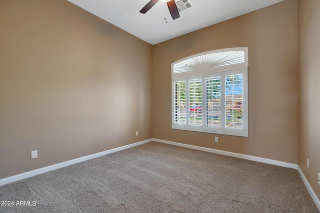 spare room with carpet and ceiling fan