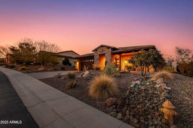 view of front of home featuring a garage and driveway