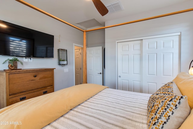 bedroom featuring a closet, visible vents, and ceiling fan