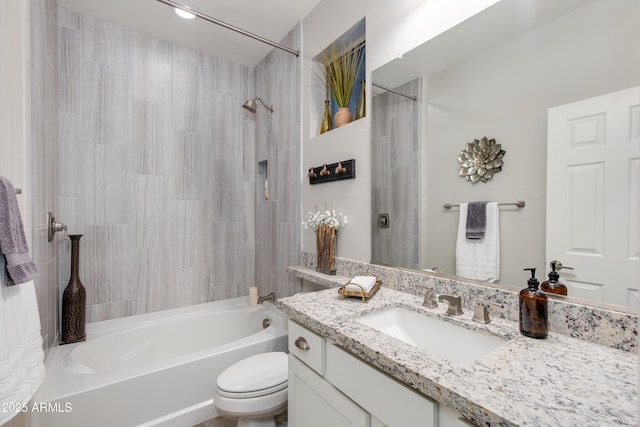 full bath with toilet, vanity, and  shower combination