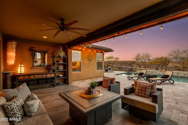 view of patio / terrace with a fenced in pool, outdoor lounge area, ceiling fan, and fence