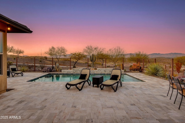 view of pool featuring a patio, a fenced backyard, and a fenced in pool