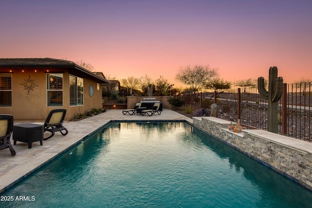 view of pool with a patio, fence, and a fenced in pool