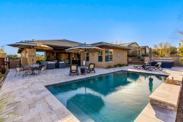 view of swimming pool with a patio area, a fenced in pool, outdoor lounge area, and fence