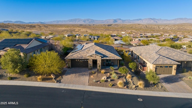 birds eye view of property with a mountain view and a residential view