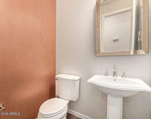 bathroom with sink and toilet