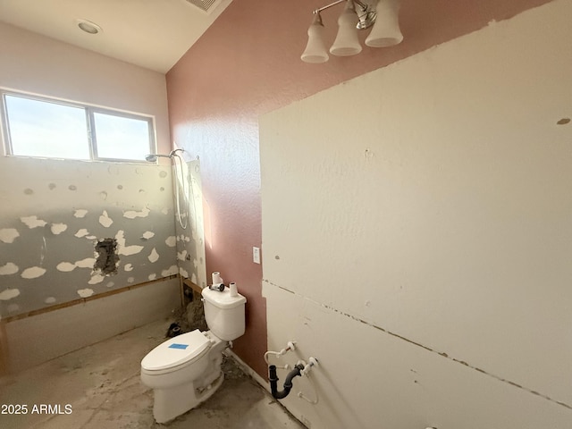 bathroom featuring toilet and shower / bathing tub combination