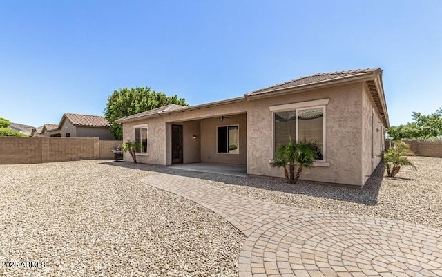 back of property featuring a patio