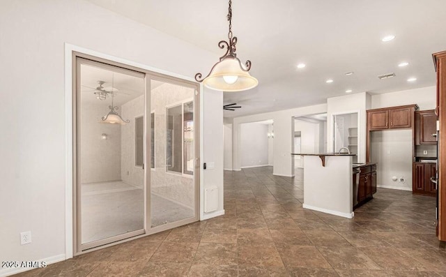 kitchen featuring hanging light fixtures and a breakfast bar area