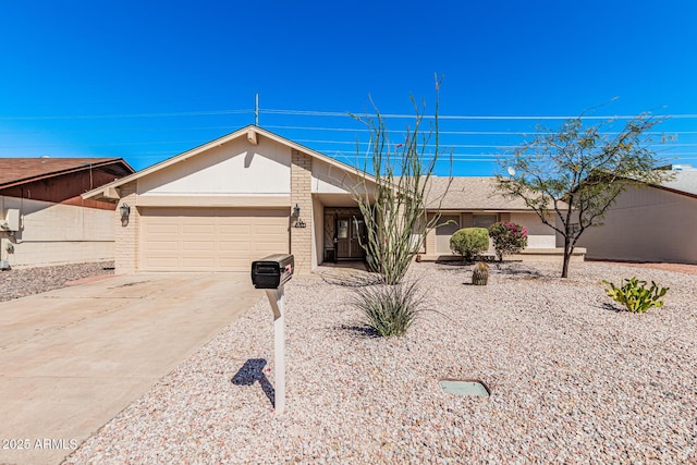 ranch-style home with concrete driveway, an attached garage, and brick siding