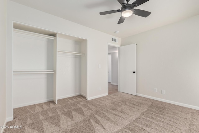 unfurnished bedroom featuring visible vents, ceiling fan, baseboards, carpet, and a closet