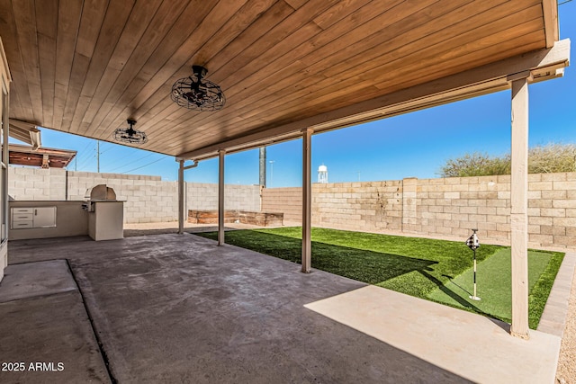 view of patio / terrace featuring exterior kitchen and a fenced backyard