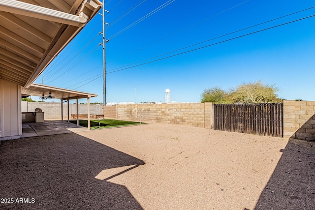 view of yard with a patio and a fenced backyard