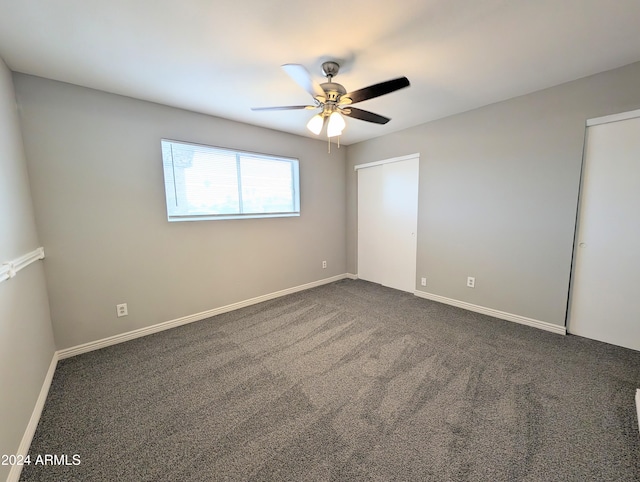 carpeted empty room with ceiling fan