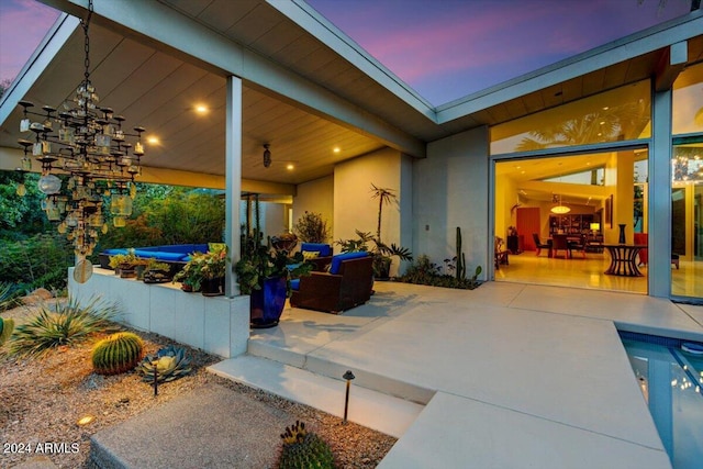 patio terrace at dusk with a jacuzzi