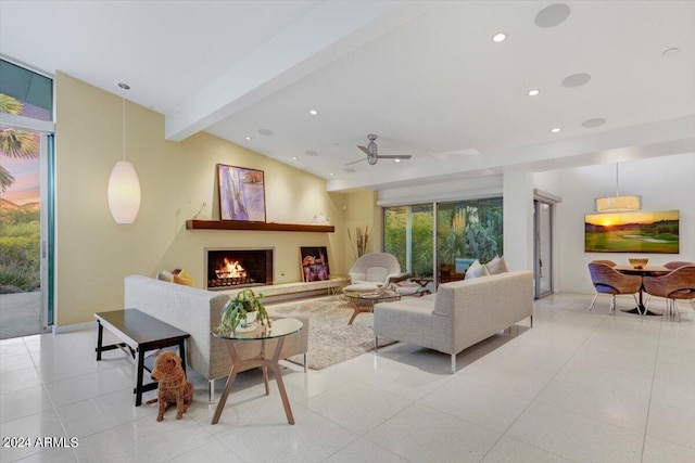 living room with lofted ceiling with beams, ceiling fan, and tile floors