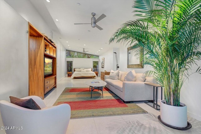 tiled living room with lofted ceiling and ceiling fan