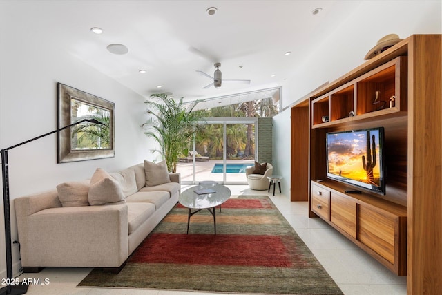 living room featuring light tile patterned floors and ceiling fan