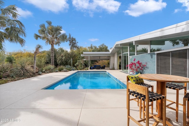 view of pool featuring a patio