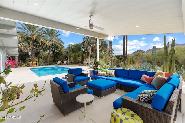 view of patio / terrace with a mountain view, ceiling fan, and outdoor lounge area