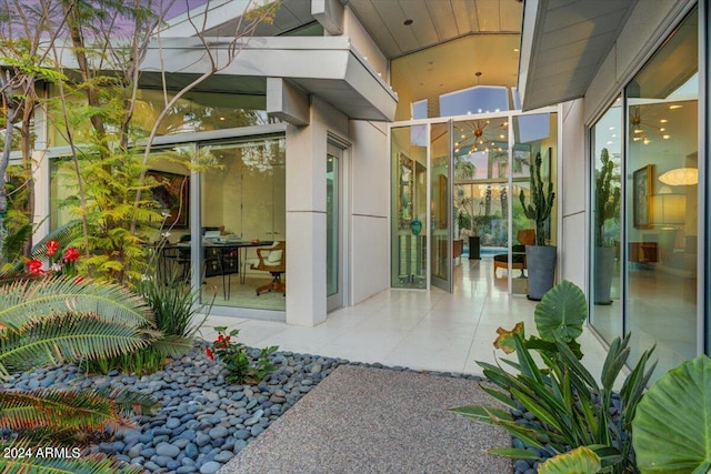 property entrance featuring a patio